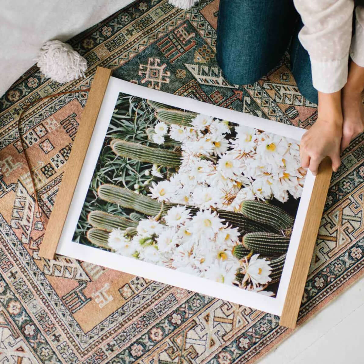 Hanging on a nail is our Hanger Frame. Hanging from a cord, 2 pieces of wood use magnets to hold the top of a print, two pieces of wood magnet to the bottom of the print.