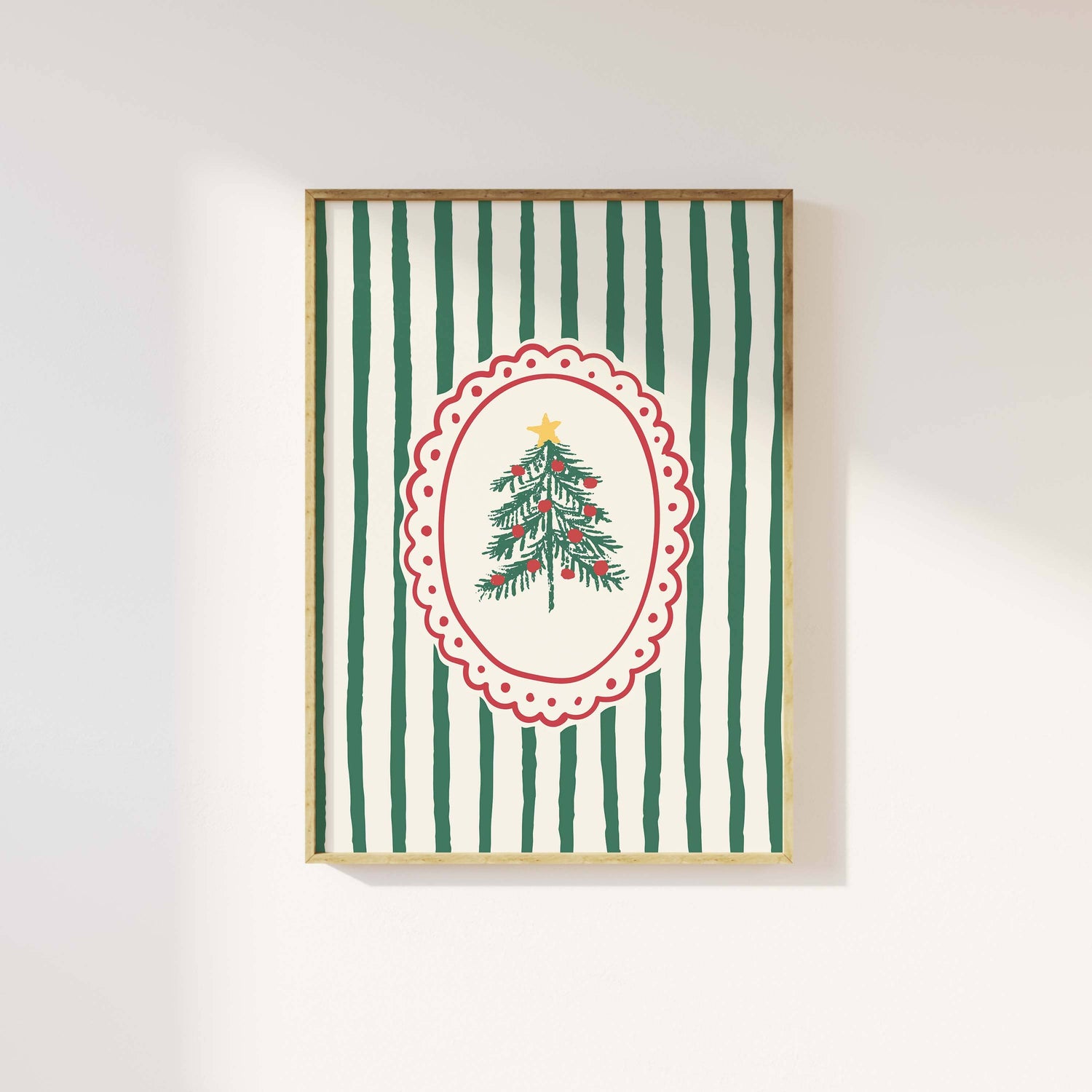 Framed artwork with a Christmas tree design on a green and white striped background