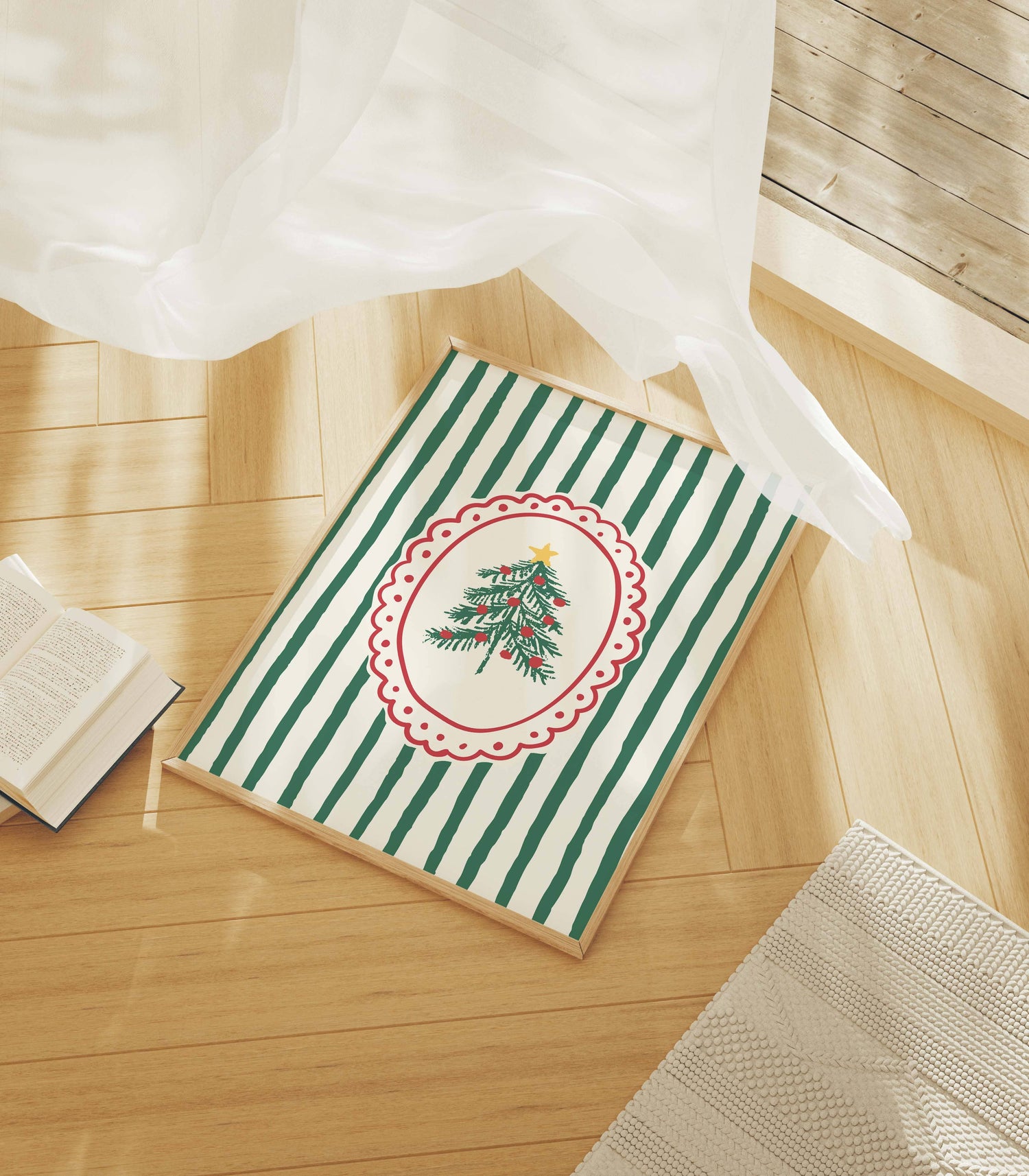 Framed artwork with Christmas tree design on a wooden floor 